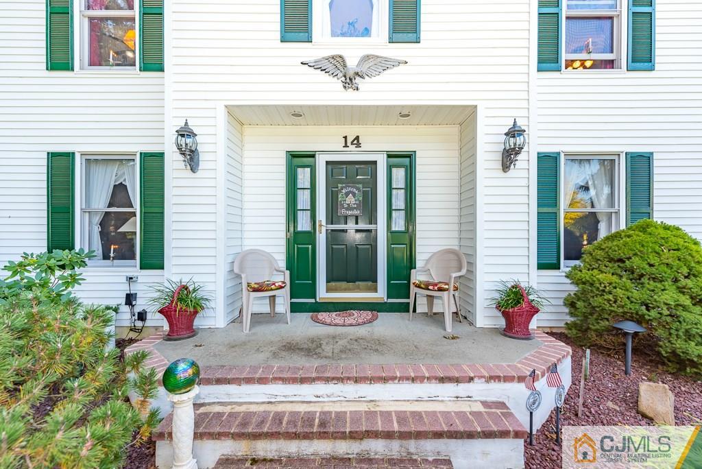 14 Crest Road Jackson, NJ 08527 - Photo 3 of 24 a front view of a house with outdoor seating