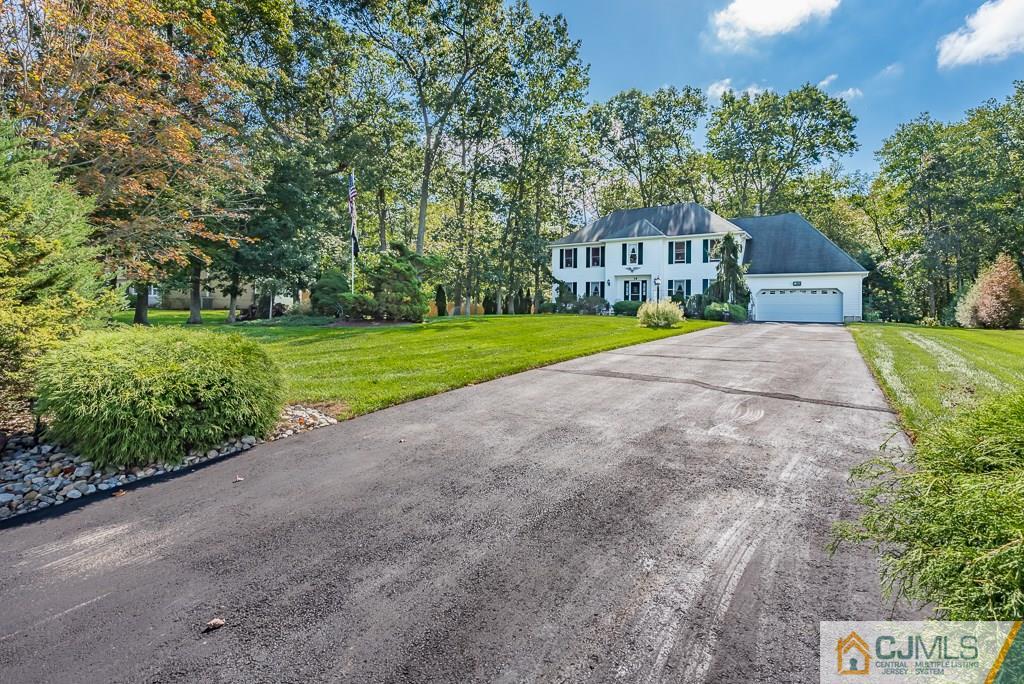 14 Crest Road Jackson, NJ 08527 - Photo 23 of 24 a view of a house with a yard and large trees