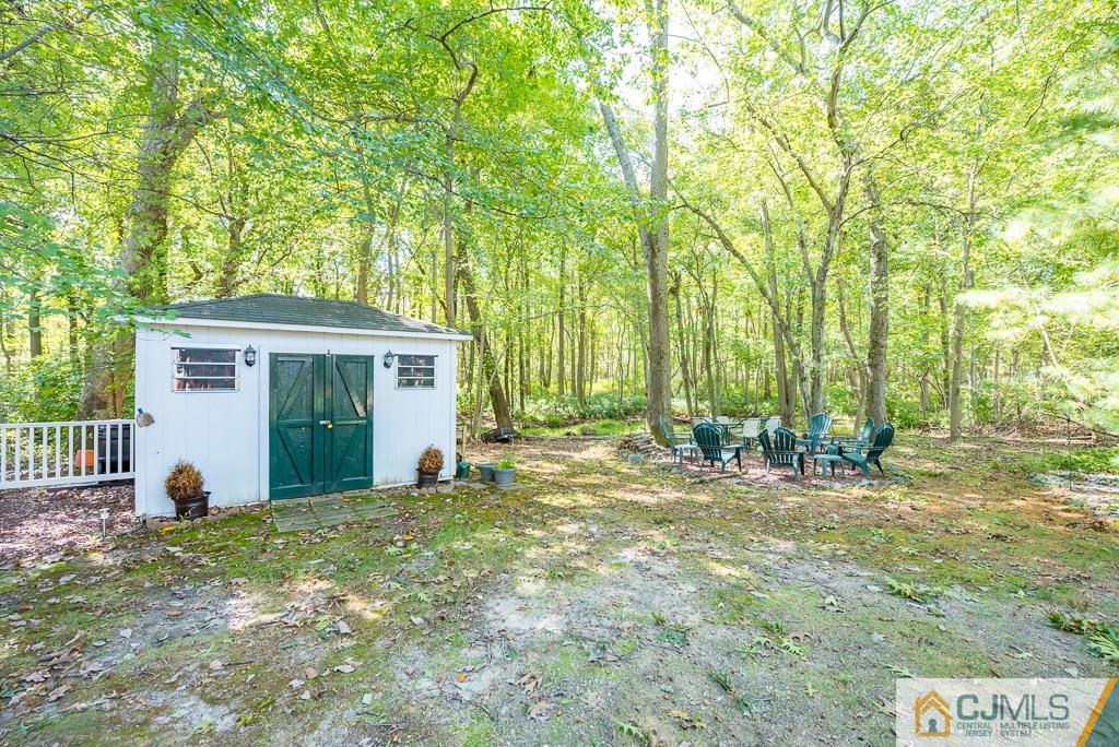 14 Crest Road Jackson, NJ 08527 - Photo 24 of 24 a view of a house with backyard and a tree