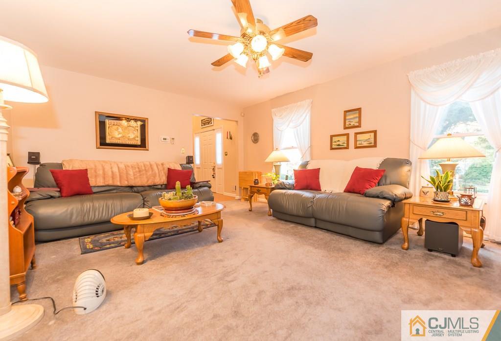 14 Crest Road Jackson, NJ 08527 - Photo 6 of 24 a living room with furniture and a couch