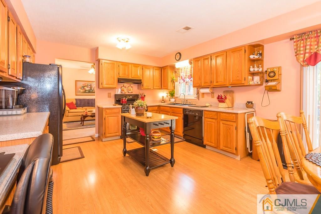 14 Crest Road Jackson, NJ 08527 - Photo 10 of 24 a view of a living room with furniture and a kitchen