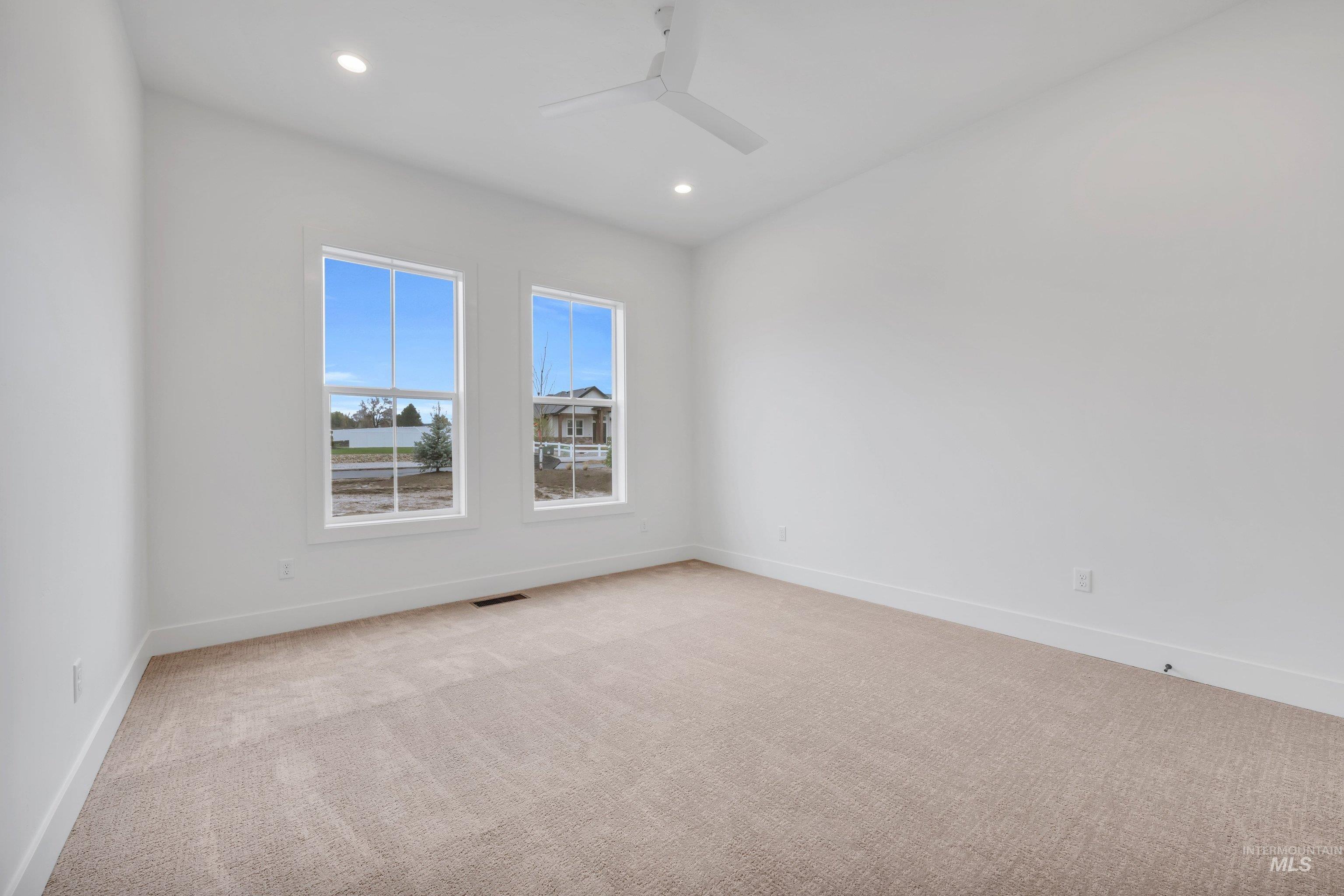 24871 Ardmore Court Caldwell, ID 83607 - Photo 24 of 44 Spare room with light carpet, recessed lighting, and a ceiling fan