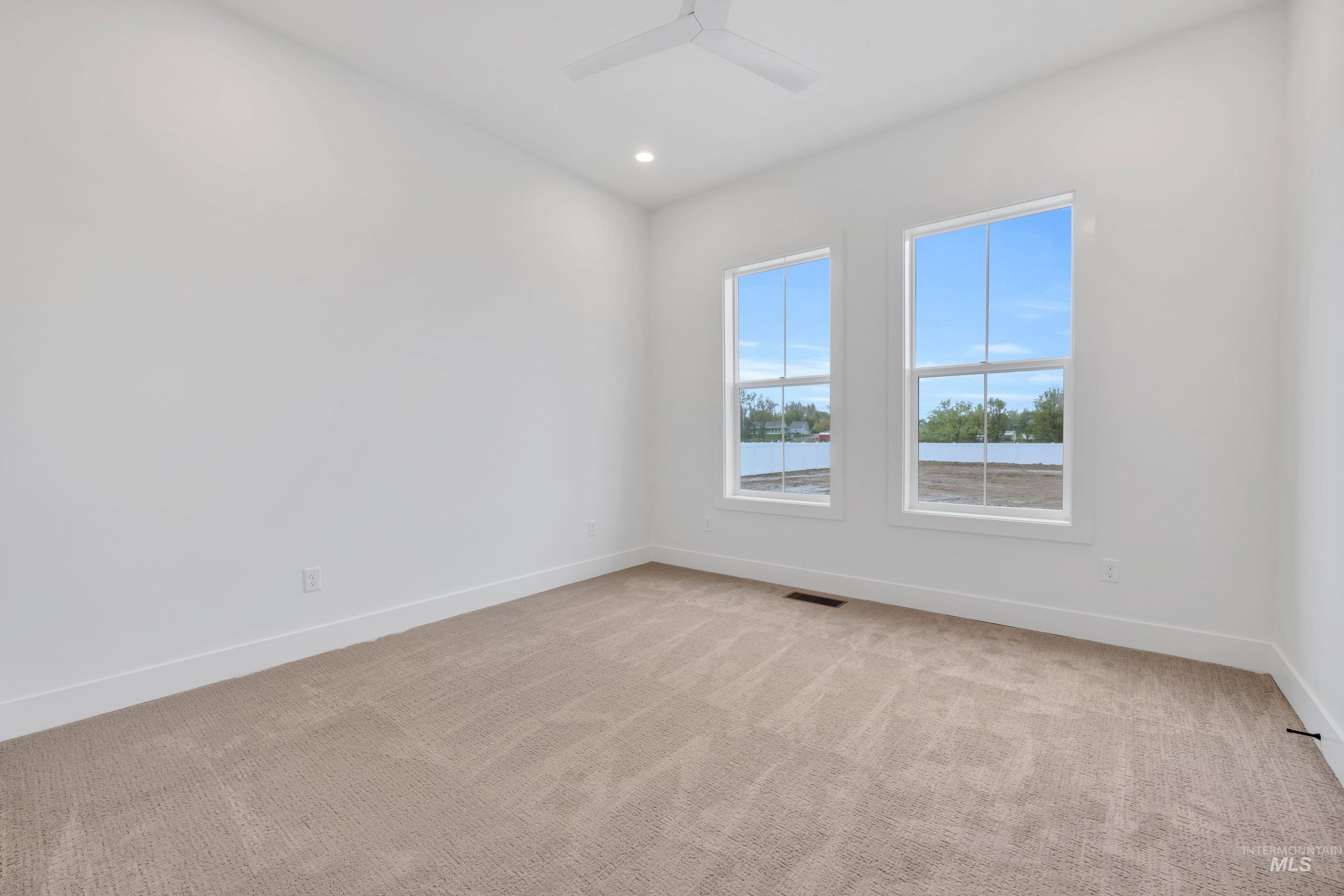 24871 Ardmore Court Caldwell, ID 83607 - Photo 35 of 44 Spare room with light colored carpet, recessed lighting, and ceiling fan