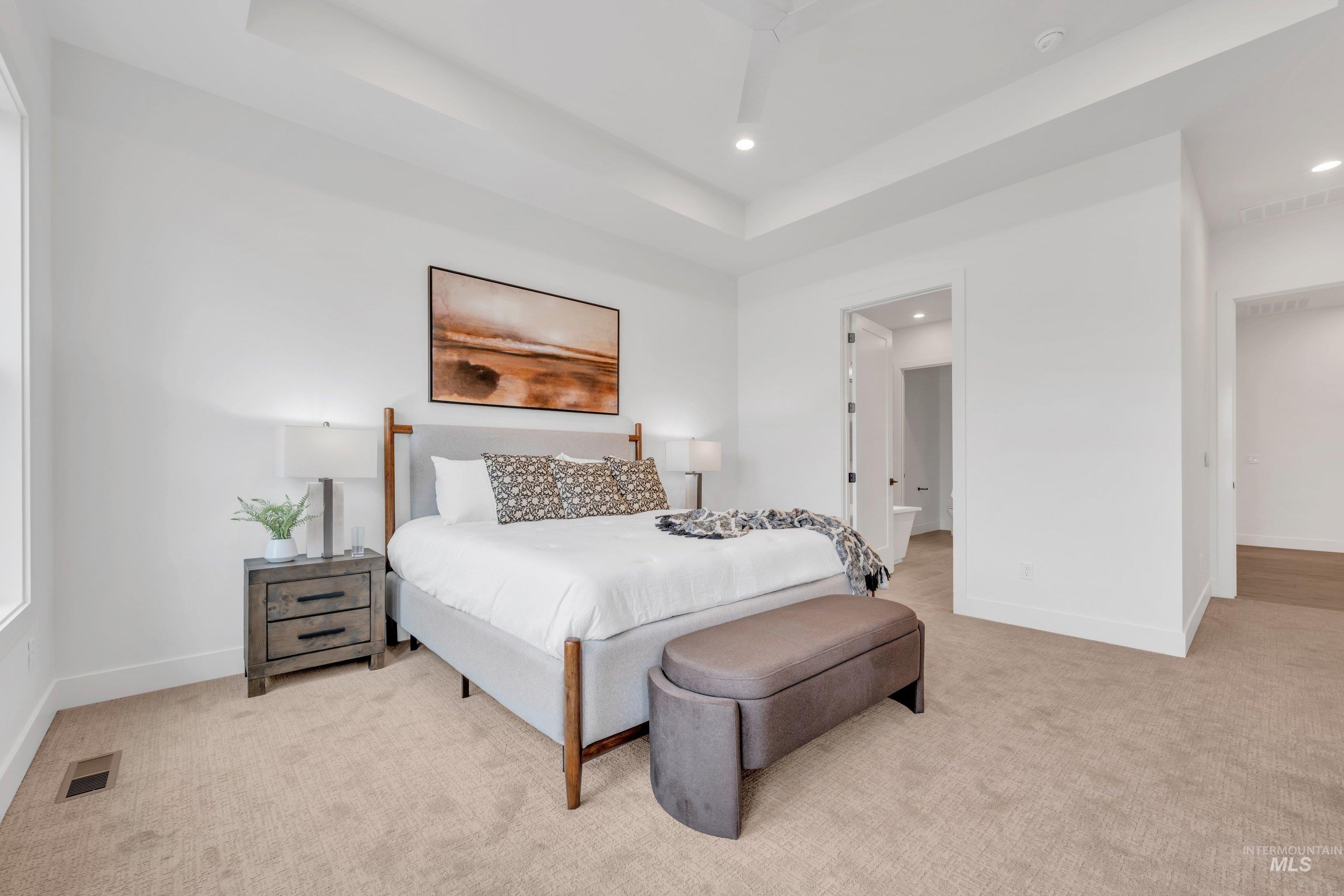24871 Ardmore Court Caldwell, ID 83607 - Photo 37 of 44 Bedroom featuring light colored carpet, recessed lighting, and a raised ceiling
