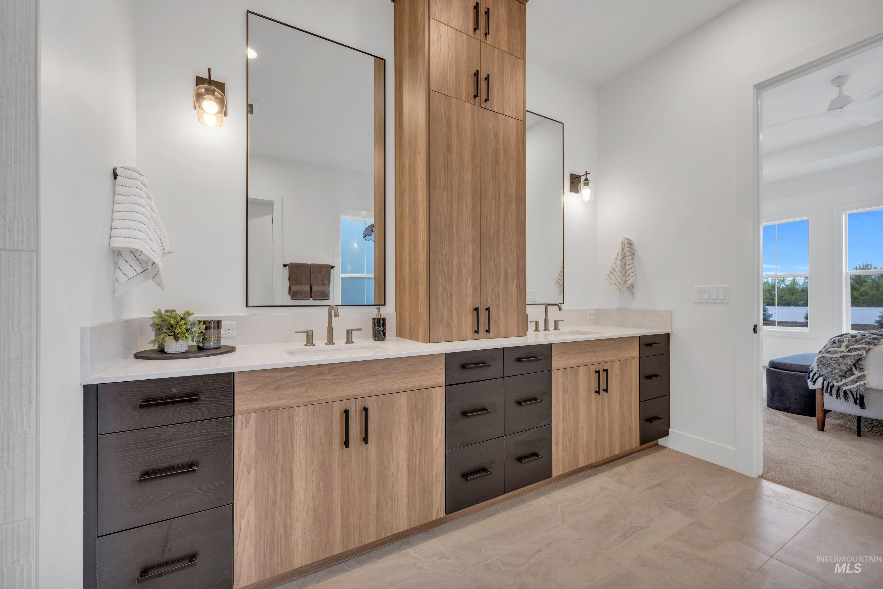 24871 Ardmore Court Caldwell, ID 83607 - Photo 39 of 44 Bathroom featuring double vanity, ensuite bathroom, and light colored carpet