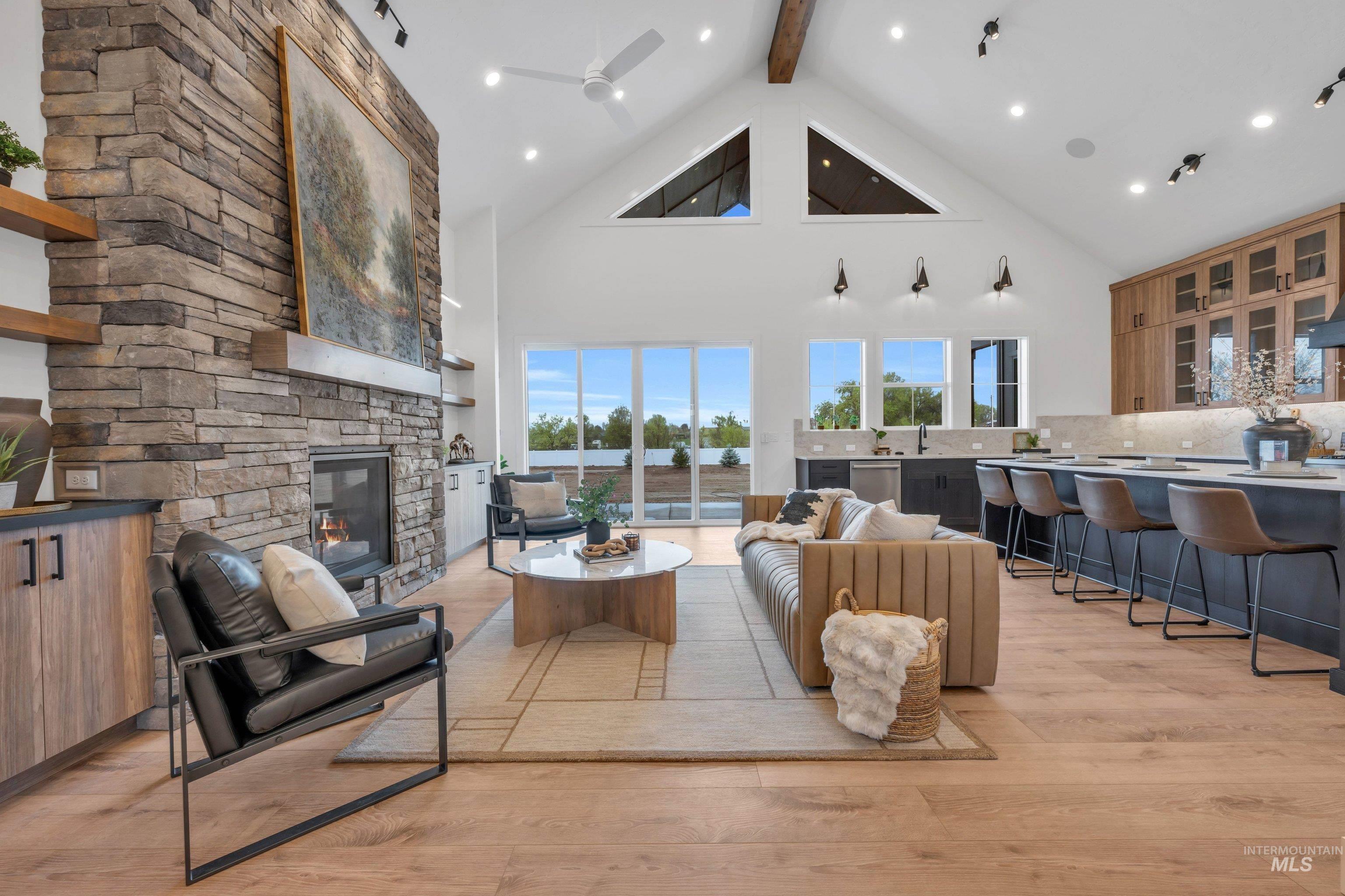 24871 Ardmore Court Caldwell, ID 83607 - Photo 5 of 44 Living room featuring light wood finished floors, a stone fireplace, ceiling fan, and recessed lighting