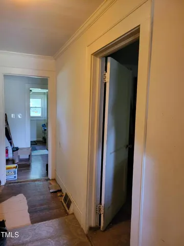 a bathroom with a sink mirror vanity and toilet