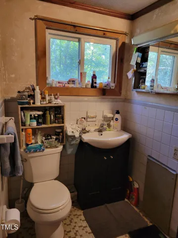a kitchen with a sink cabinets and window