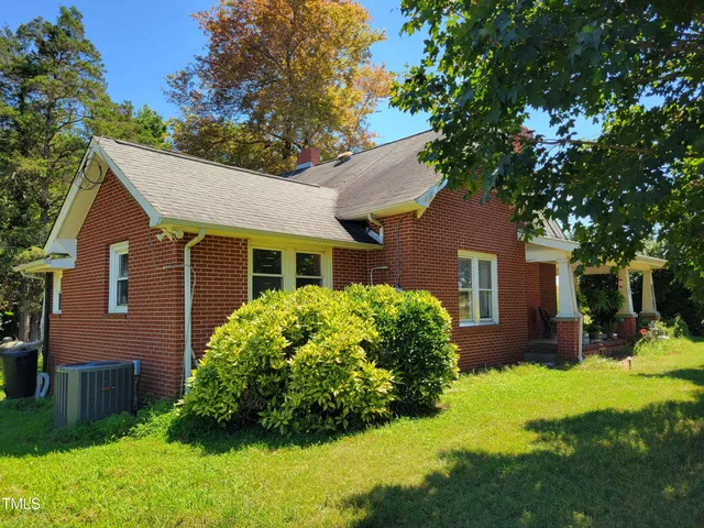 a view of a wooden door of the house