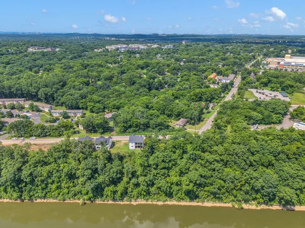 an aerial view of a houses with yard