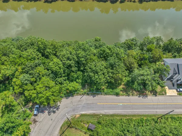 a view of a lake with a yard