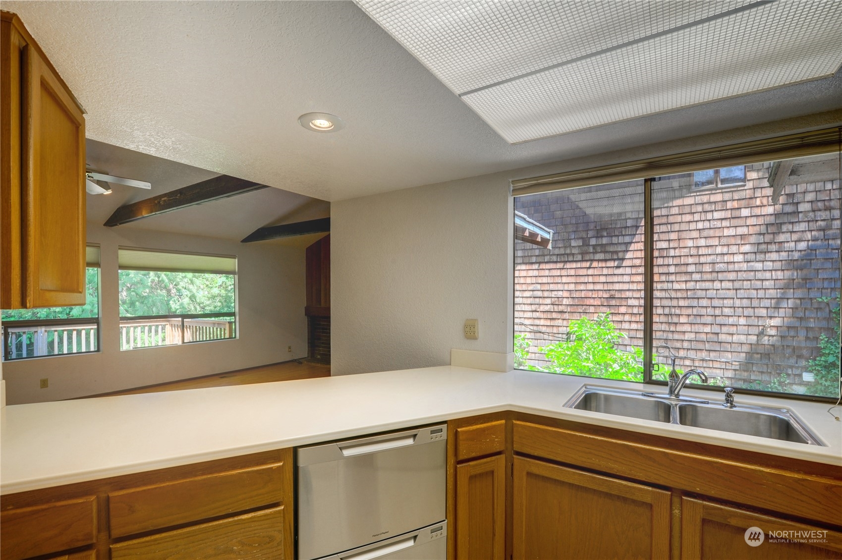 717 Daley Street Edmonds, WA 98020 - Photo 15 of 40 a kitchen with a sink and large window
