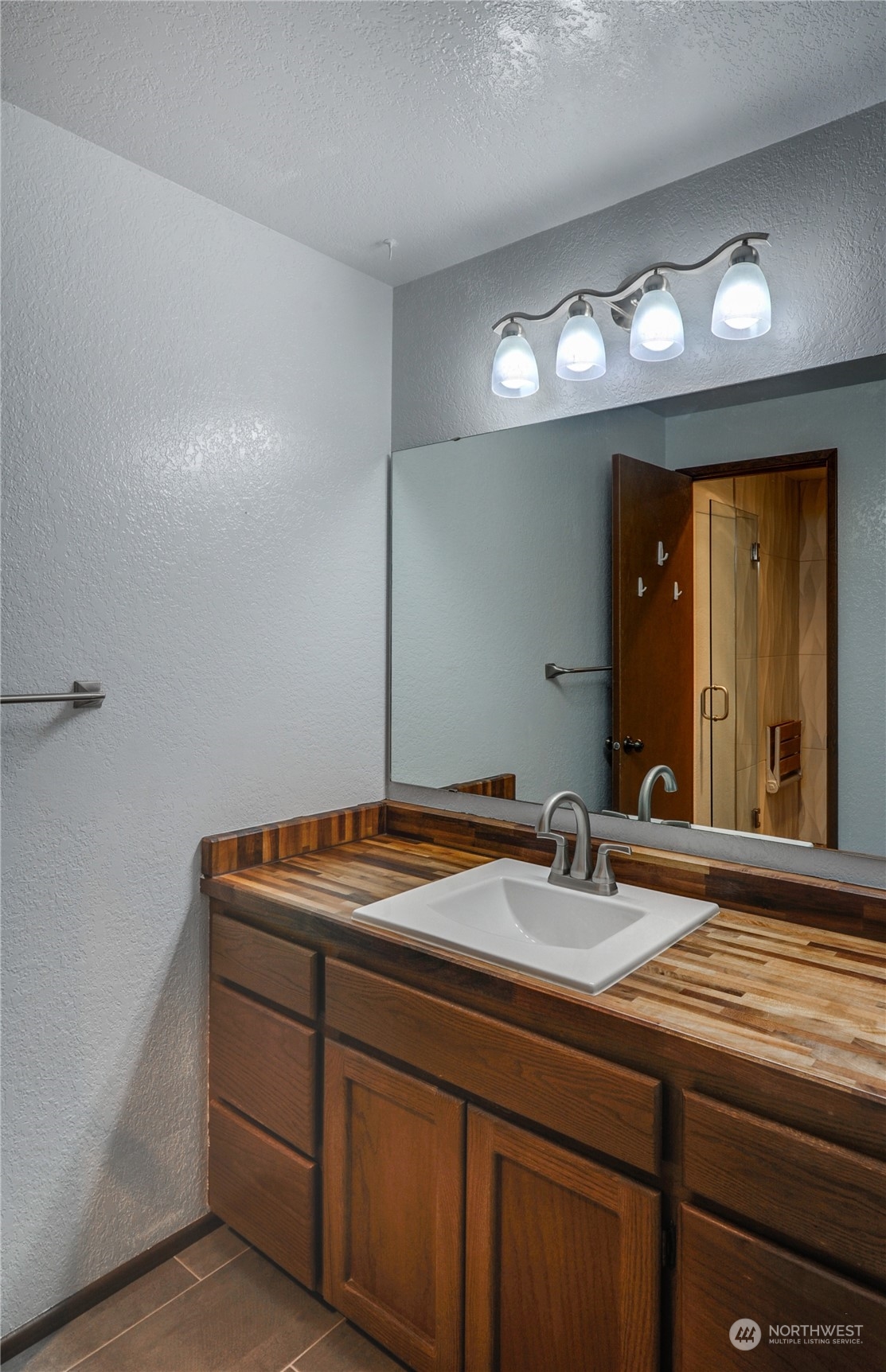 717 Daley Street Edmonds, WA 98020 - Photo 18 of 40 a bathroom with a sink and a mirror