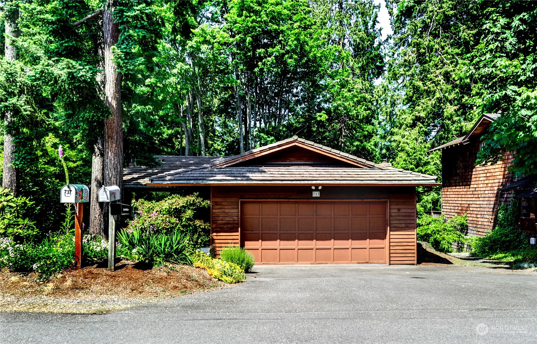 717 Daley Street Edmonds, WA 98020 - Photo 2 of 40 a front view of a house with a garden
