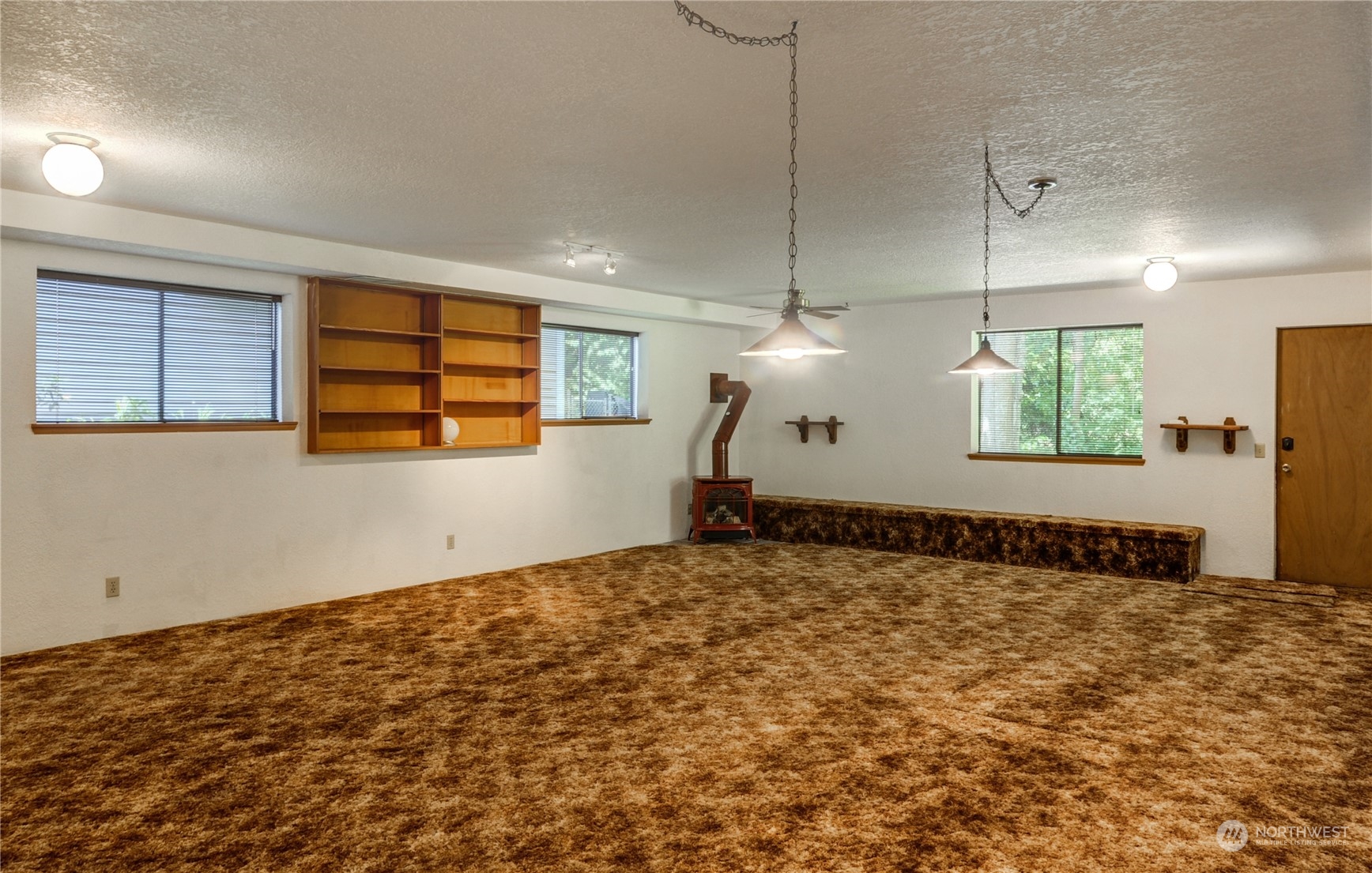717 Daley Street Edmonds, WA 98020 - Photo 26 of 40 a view of a livingroom with wooden floor and window
