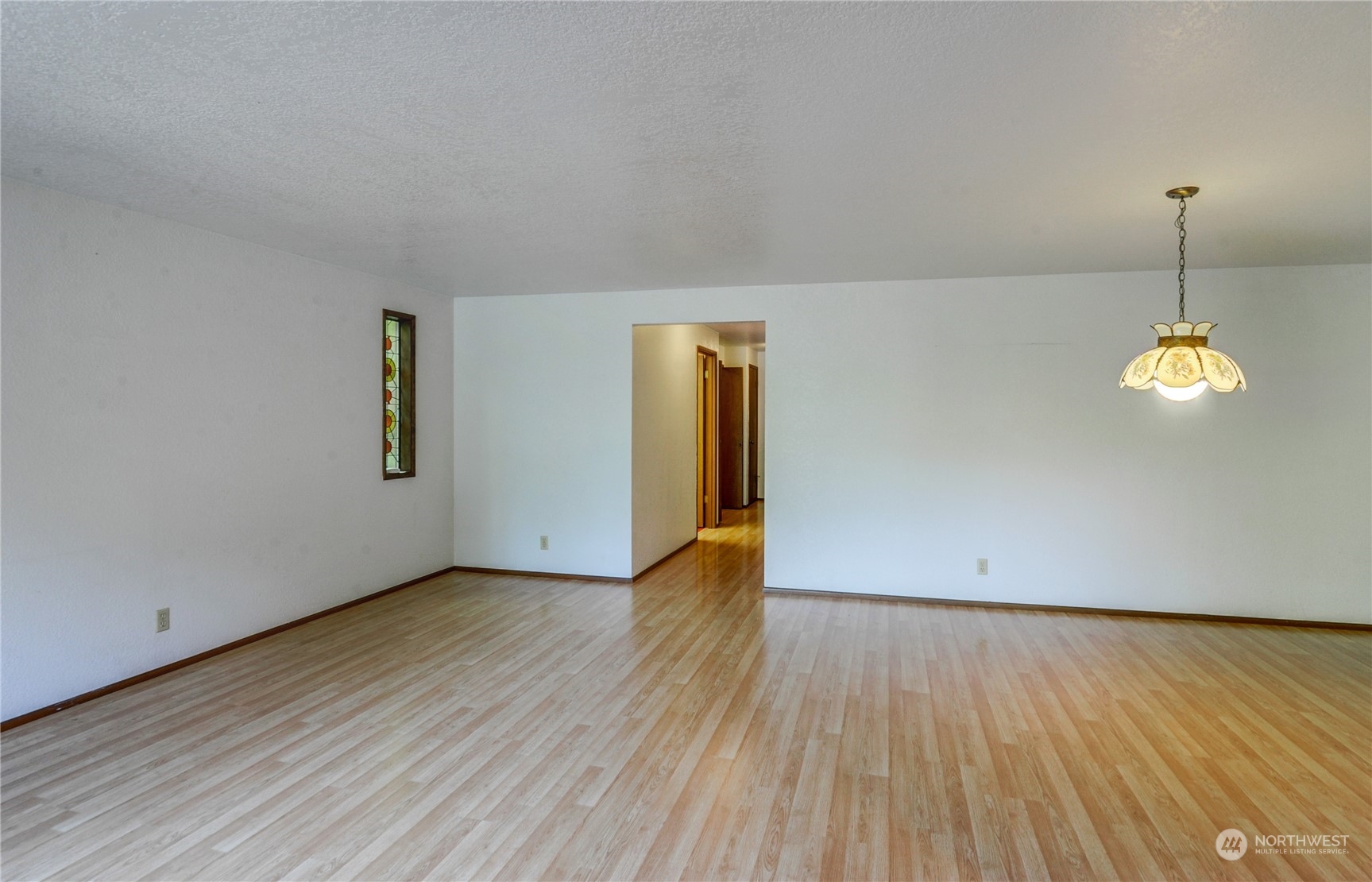 717 Daley Street Edmonds, WA 98020 - Photo 7 of 40 a view of empty room with wooden floor and fan