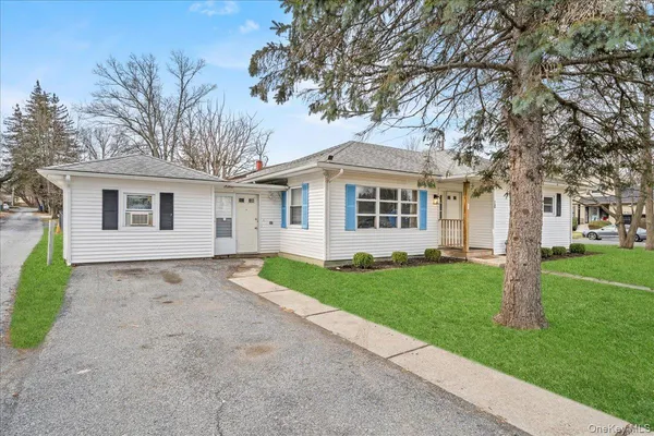 front view of a house and a yard