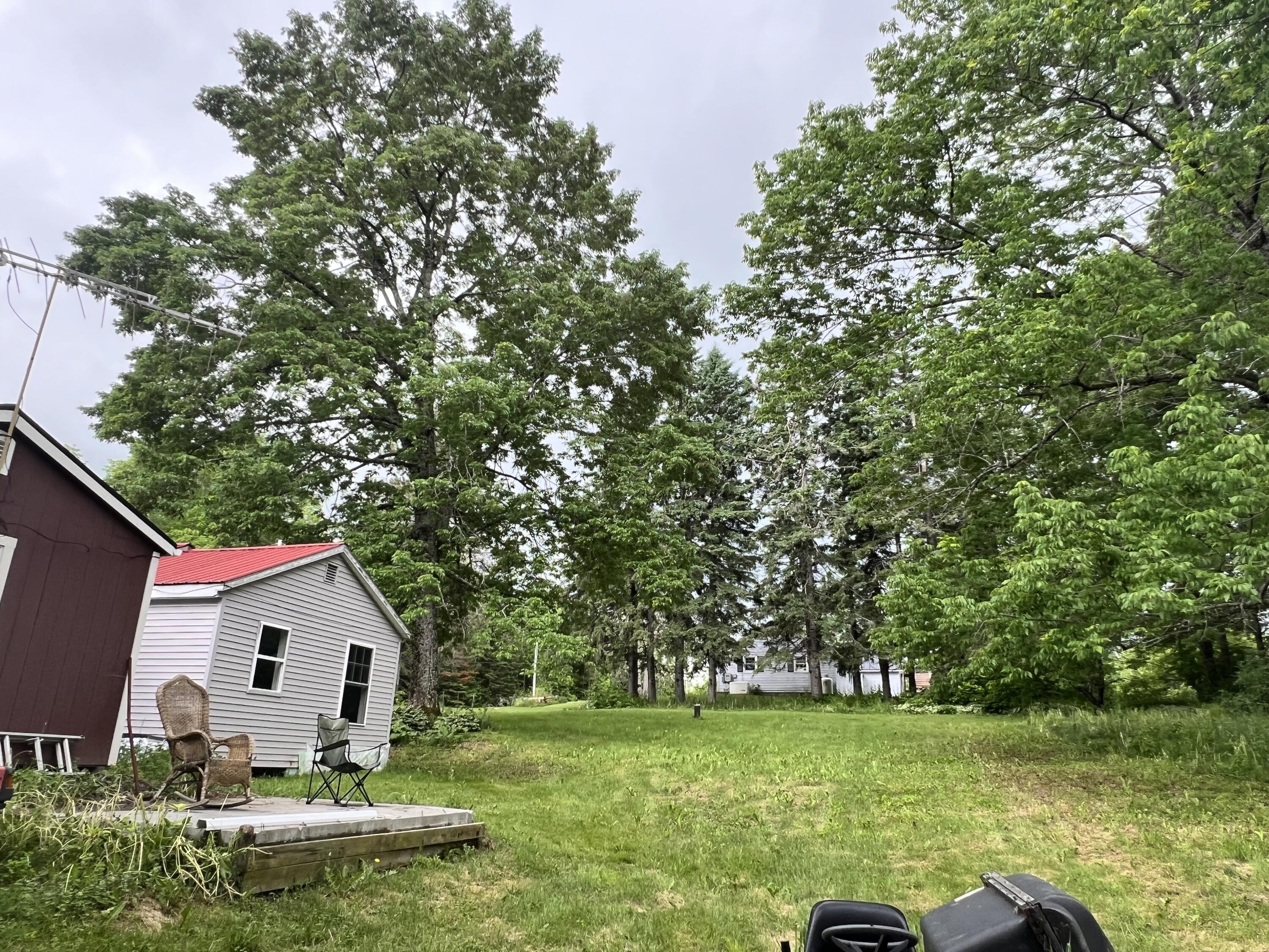 127 Wellington Road Parkman, ME 04443 - Photo 3 of 22 back side lawn