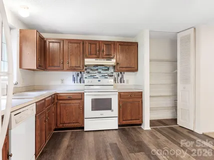 a kitchen with stainless steel appliances granite countertop a stove and a sink