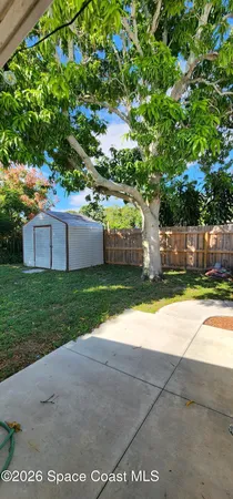 a house view with a garden space