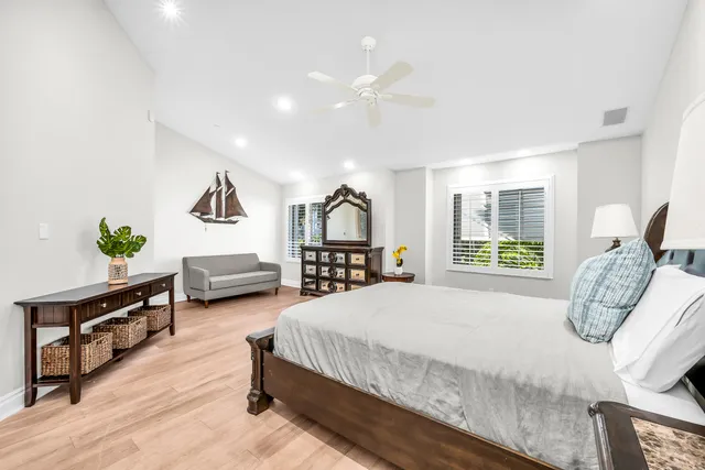 a bedroom with furniture and a window