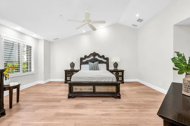 a spacious bathroom with a sink a large mirror and shower