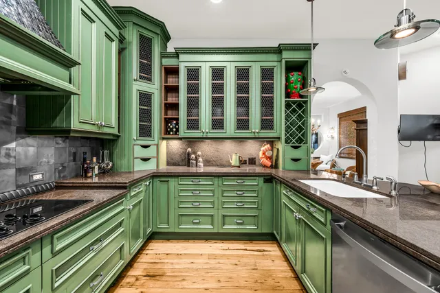 a kitchen with a sink and cabinets