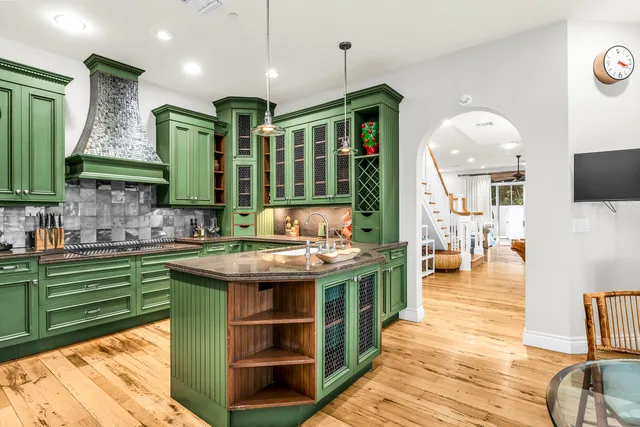 a kitchen with a sink and wooden cabinets