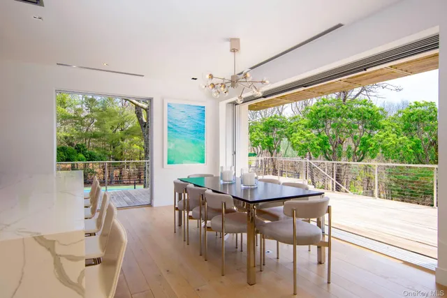 a view of a dining room with furniture window and outside view