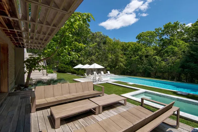 a view of a patio with swimming pool