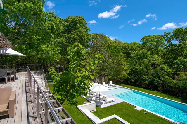 a view of a chairs and table in the patio