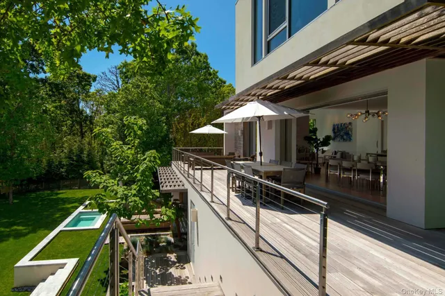 a view of a balcony with chairs
