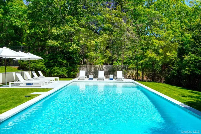 a view of a swimming pool with a patio