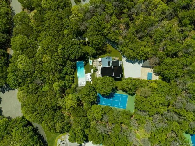a yellow building with trees in front of it