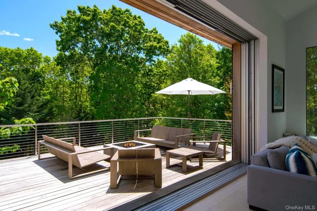 a view of sitting area with furniture and barbeque grill