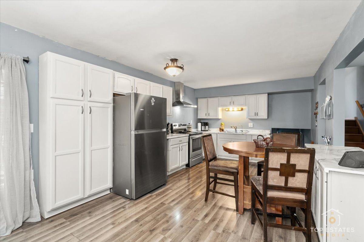 48W201 Keslinger Road Maple Park, IL 60151 - Photo 16 of 48 a kitchen with stainless steel appliances a refrigerator stove microwave and cabinets