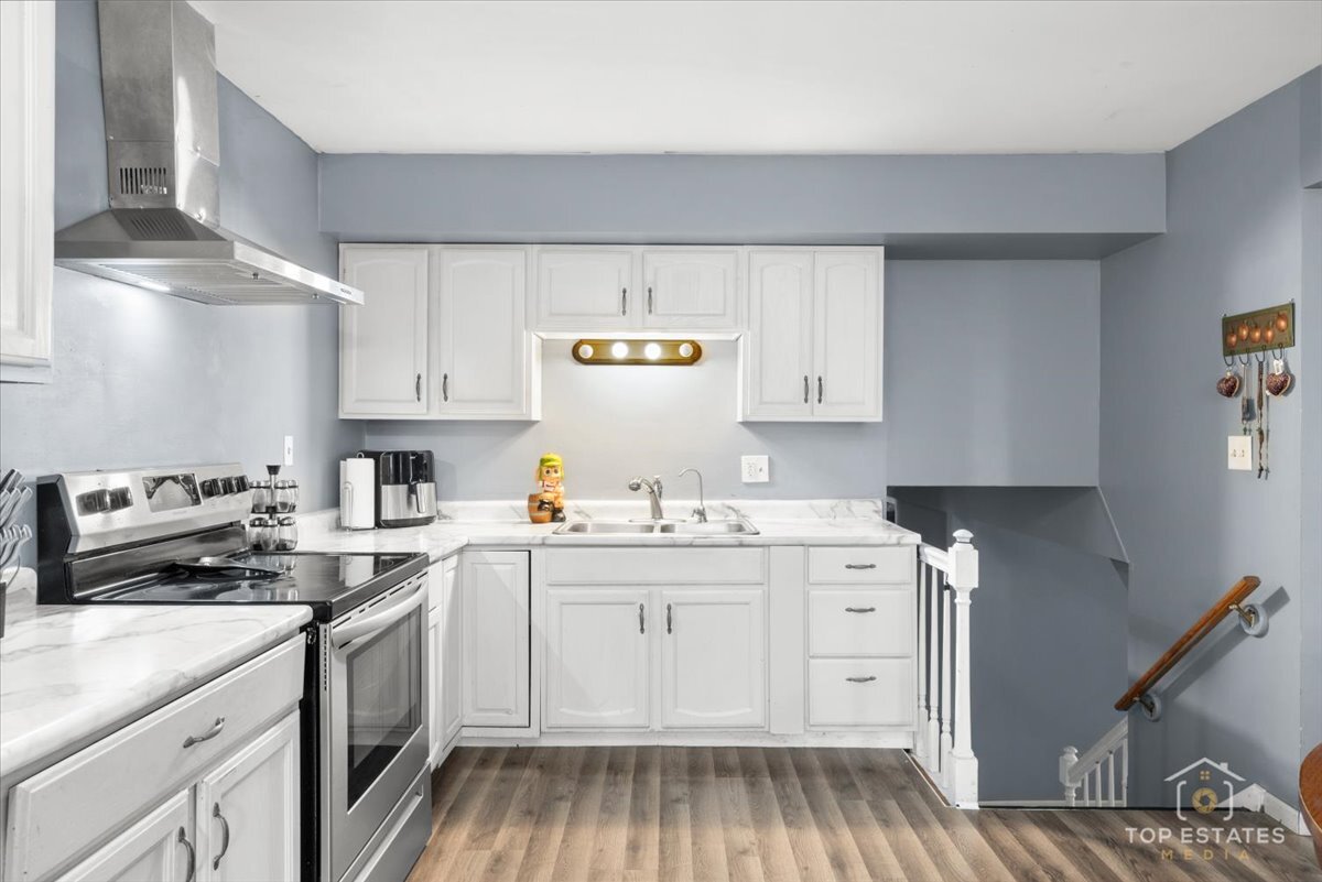 48W201 Keslinger Road Maple Park, IL 60151 - Photo 18 of 48 a kitchen with a sink stove and cabinets