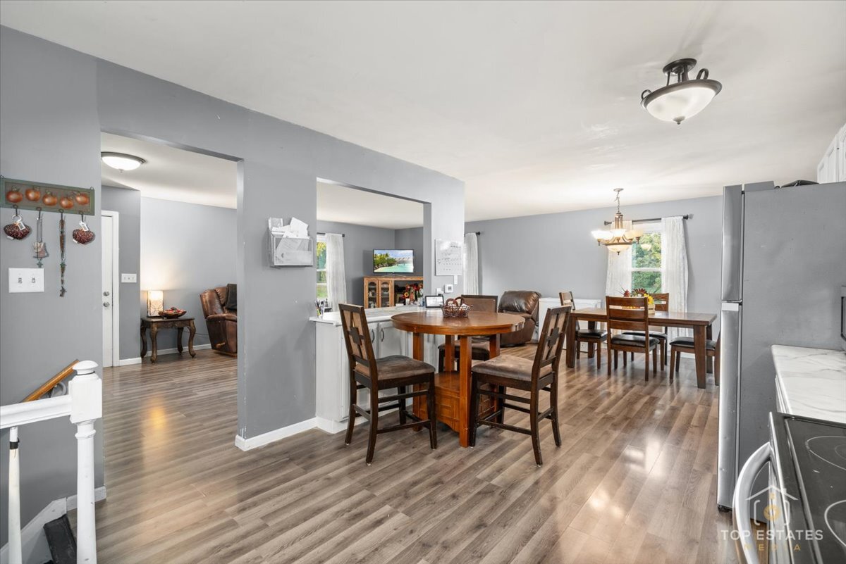 48W201 Keslinger Road Maple Park, IL 60151 - Photo 21 of 48 a view of a dining room with furniture and wooden floor