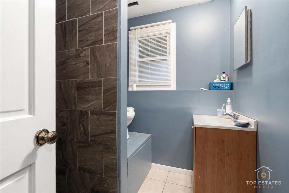 48W201 Keslinger Road Maple Park, IL 60151 - Photo 30 of 48 a bathroom with a sink toilet and shower