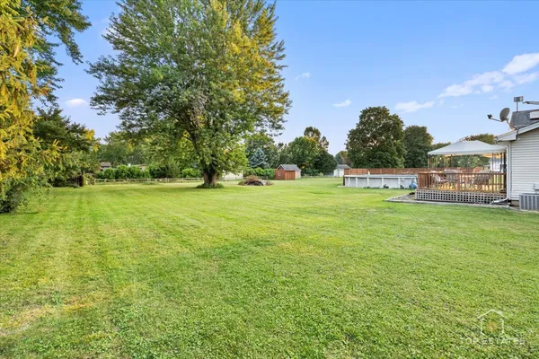 a view of a green field with clear sky
