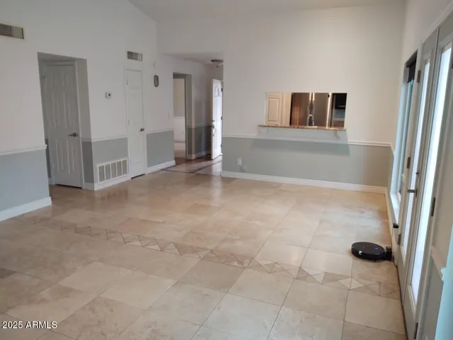 a view of empty room with a fireplace