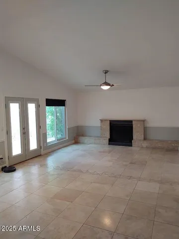 an empty room with windows and closet