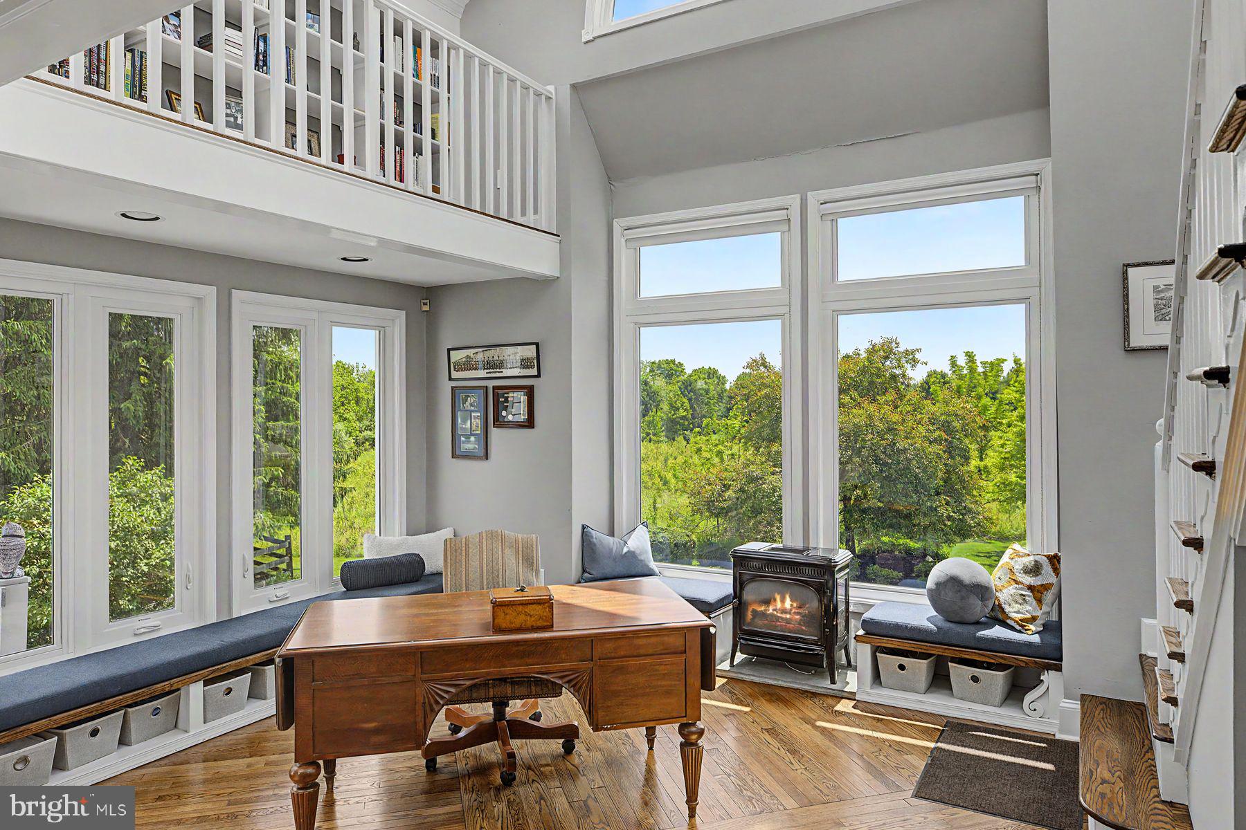 4009 Smoke Road Doylestown, PA 18902 - Photo 22 of 52 a view of a dining room with furniture large windows and wooden floor
