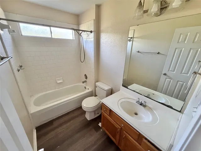 a front view of a house with yard and garage