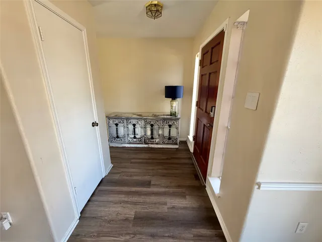 a view of an entryway with wooden floor