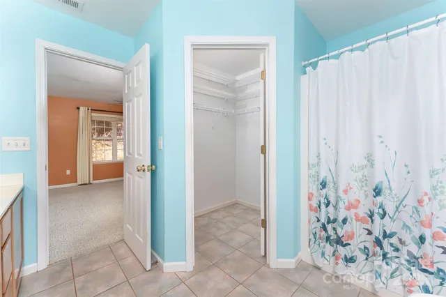 a view of a bathroom with a shower and a sink