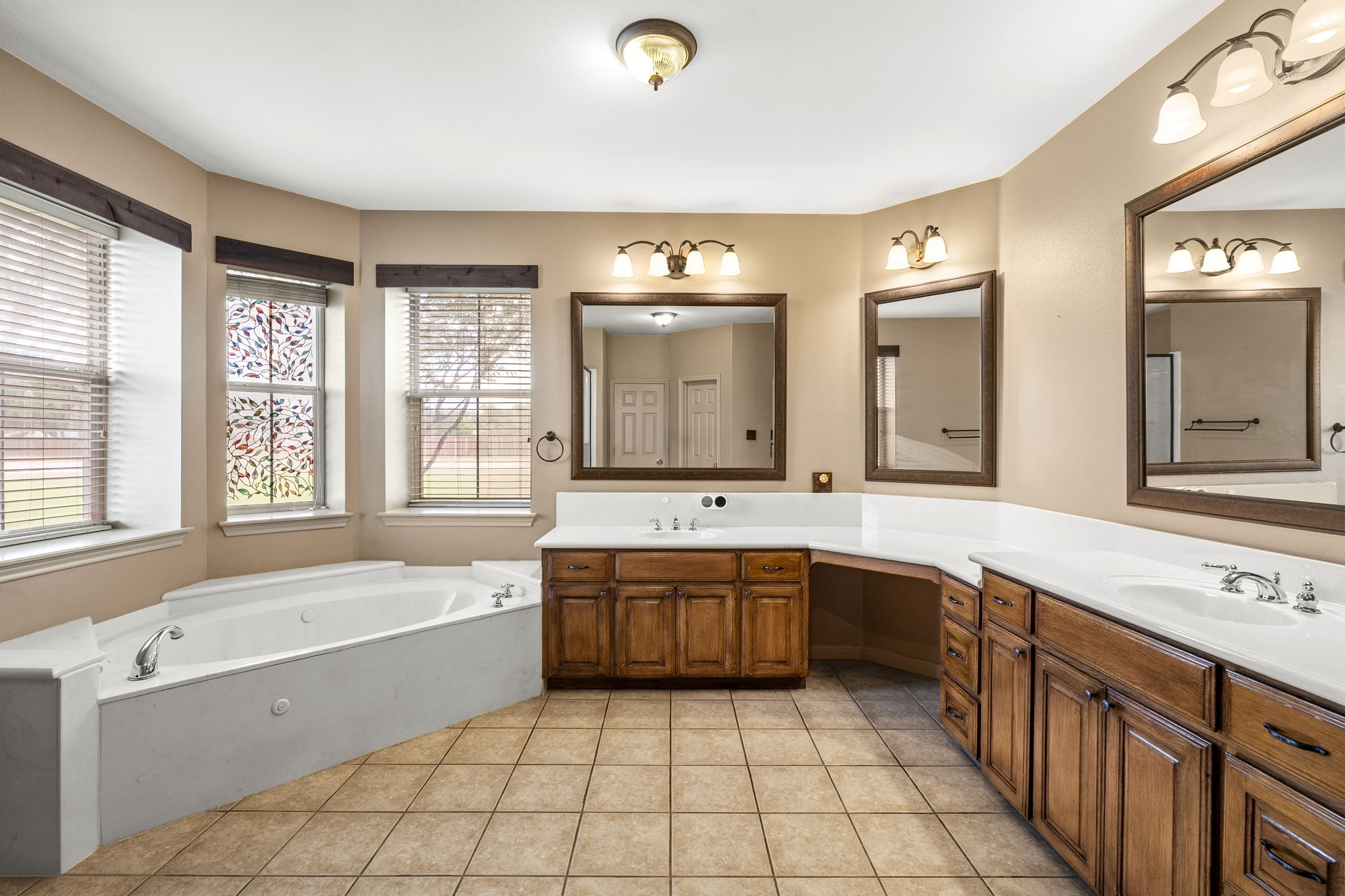 101 Landons Way Georgetown, TX 78633 - Photo 15 of 32 Primary bathroom with double vanity and tub/shower combination