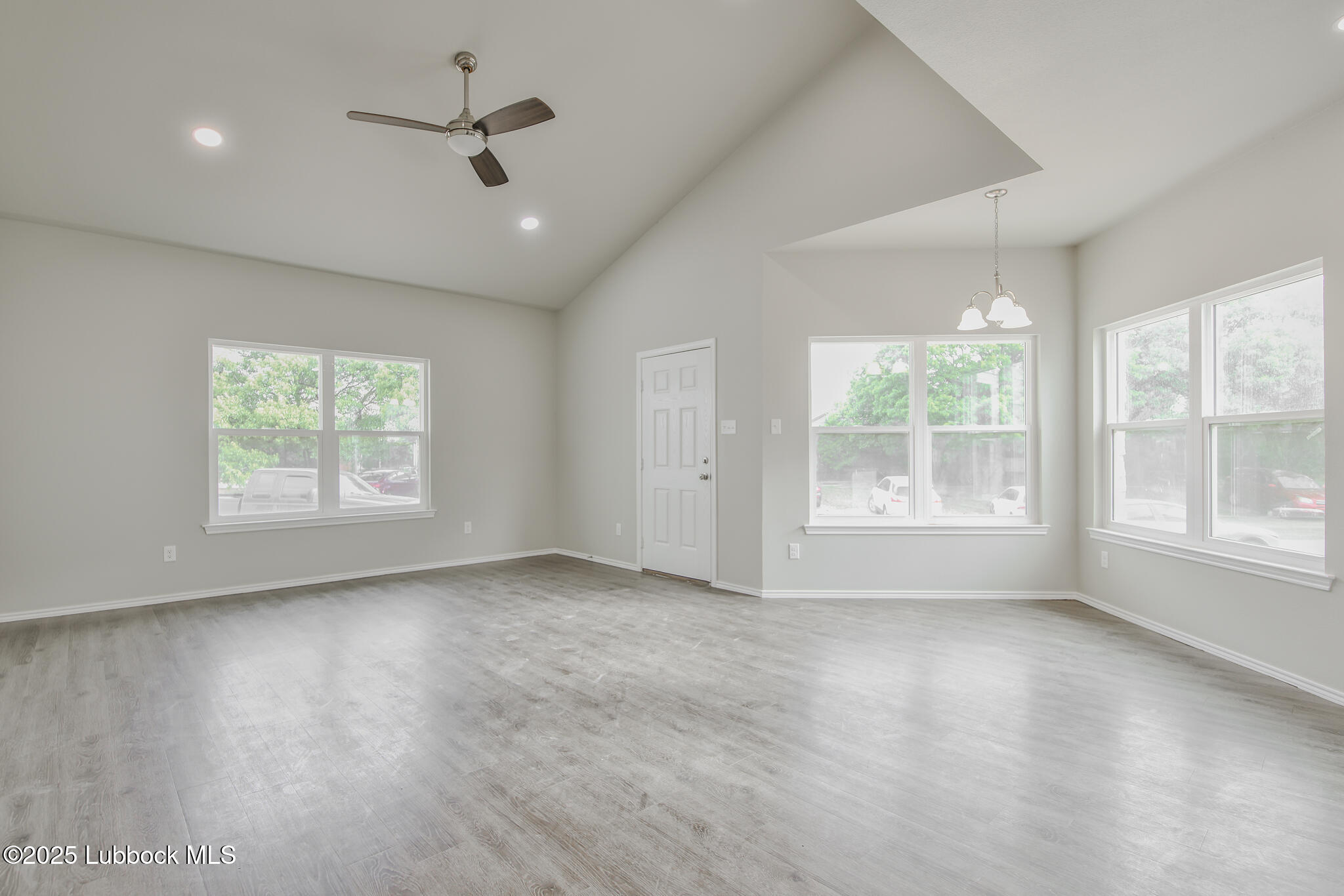 3119-3121 74th Street Lubbock, TX 79423 - Photo 8 of 37 a view of an empty room with a window