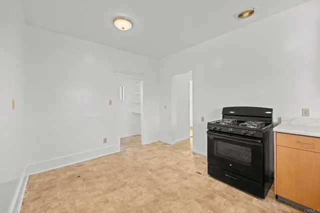 a view of an empty room with wooden walls