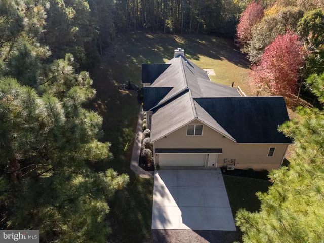 a view of a bedroom with wooden floor and hallway